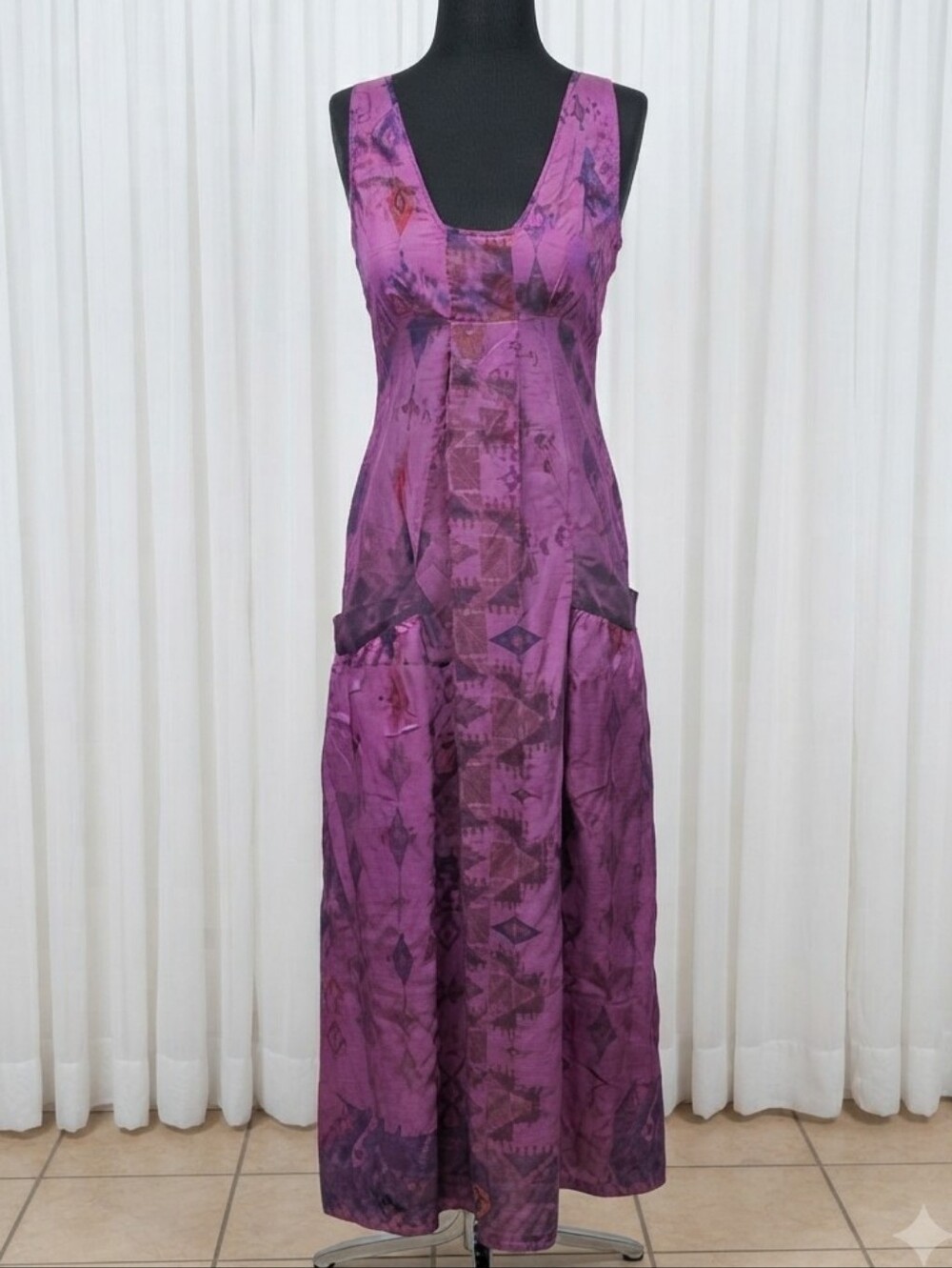 Stella Forest brand maxi dress featuring a distinctive purple geometric pattern.